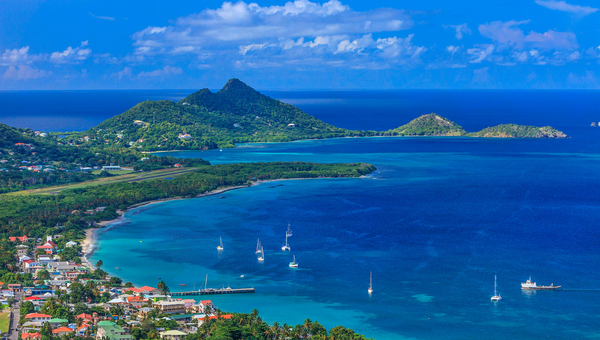 Aerial view of Carriacou island with Hillsborough Bay, sailing yachts and the Grenadines in the background, near Las Tortugas Villa